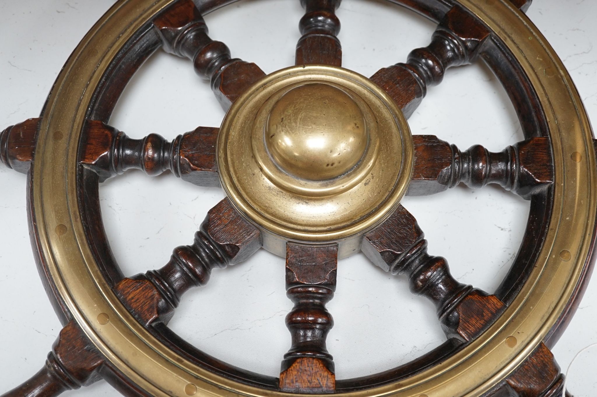 A 19th century mahogany and brass mounted ship's wheel, 60cm